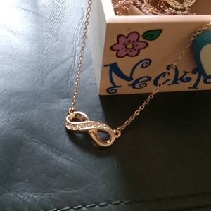 Infinity symbol necklace in rose tone